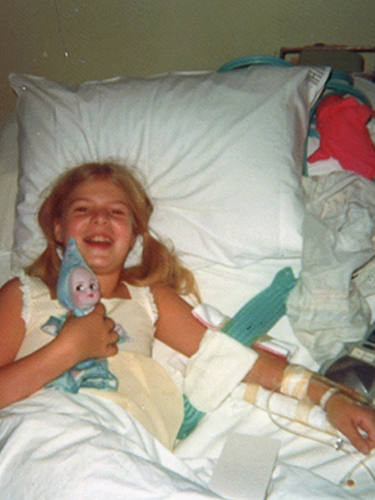 A young Tammy Baldwin in a hospital bed